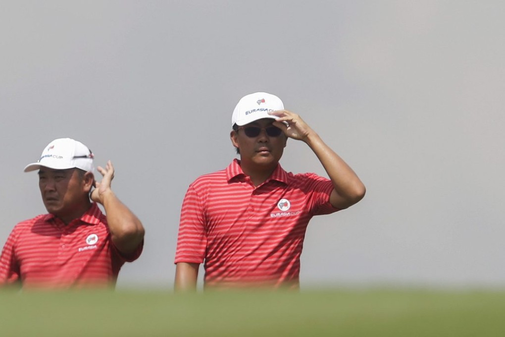 Malaysia’s Danny Chia (left) and his compatriot Nicholas Fung (right) of Team Asia react during the foursome match of the EurAsia Cup golf tournament in Shah Alam, Malaysia. Photo: EPA