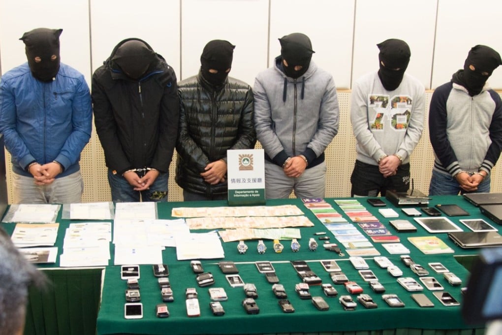 Some of the suspects arrested in connection with the alleged casino junket extortion racket. Photo: Xinhua