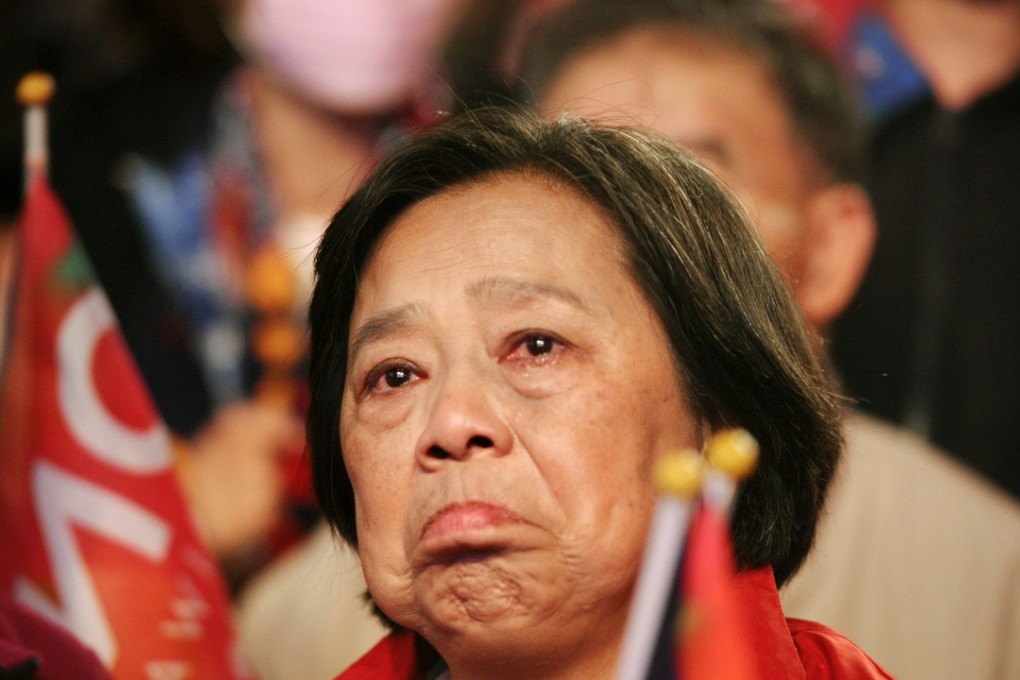 One supporter found it hard to suppress her tears. Photo: CNA