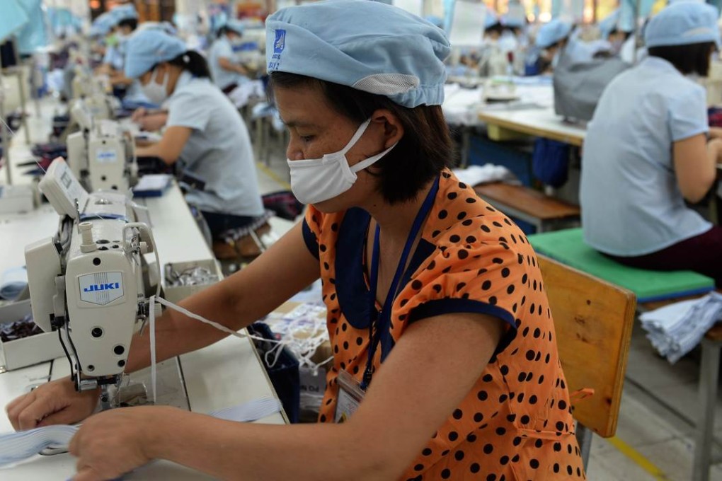 Female garment workers on a production line on the outskirts of Hanoi. Photo: AFP