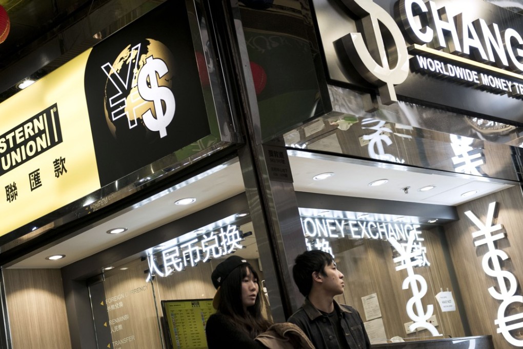 A currency exchange store in Hong Kong. Borrowing costs for offshore yuan in the city shot up by 200 per cent at one point last week. Photo: Bloomberg