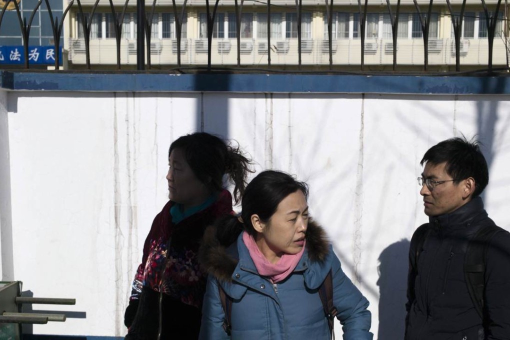 Family members and lawyers of detained lawyers and their colleagues gather outside a detention centre in Tianjin this month in an attempt to seek answers. Photo: AFP