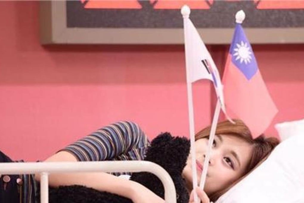 Youtube capture of Chou Tzu-Yyu waving a Taiwan flag.