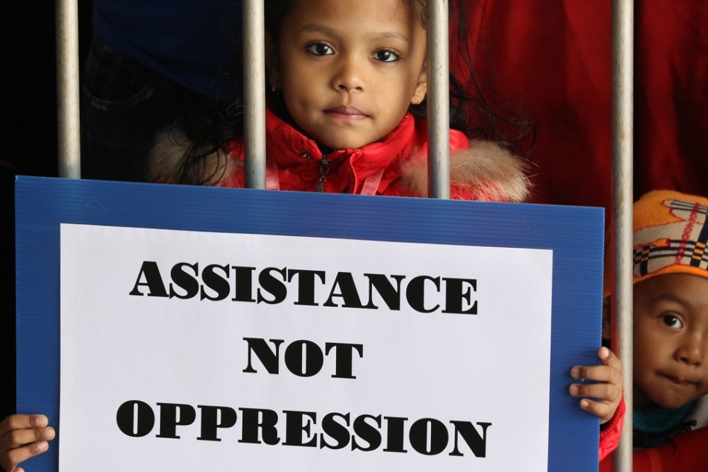 Young children were among more than 100 asylum seekers who gathered outside Legco to appeal for improvements to the screening mechanism. Photo: Dickson Lee