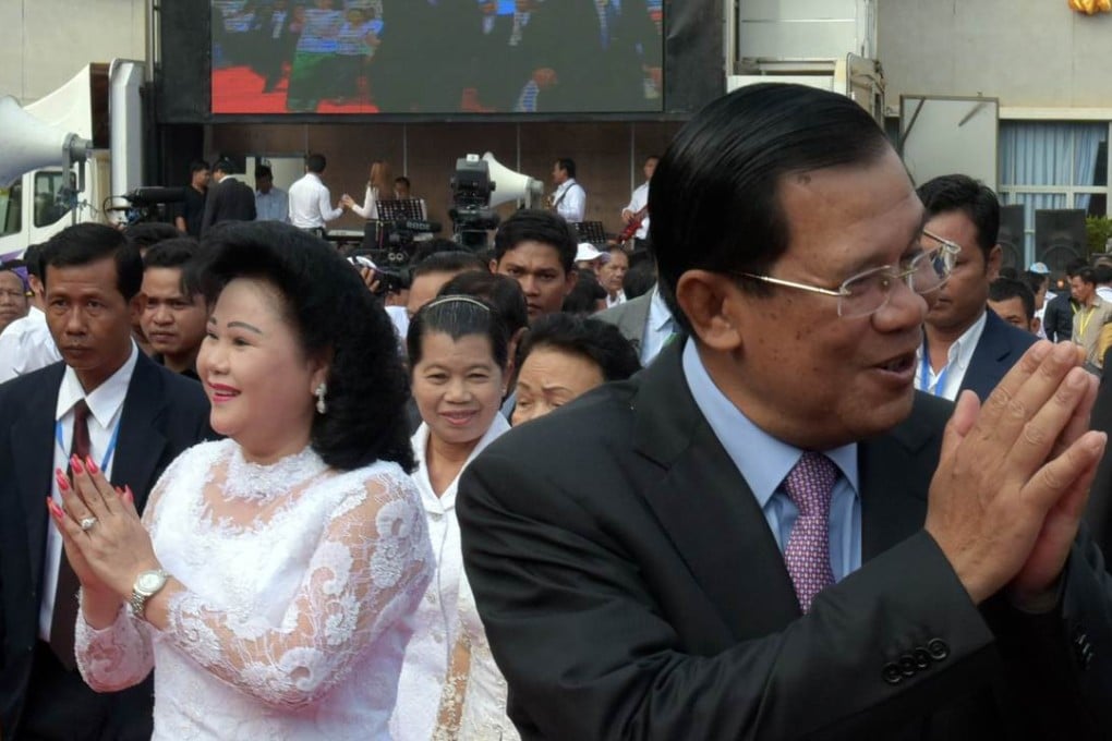 Cambodian Prime Minister and president of the Cambodian People's Party (CPP) Hun Sen (R) and his wife Bun Rany (left). Photo: AFP