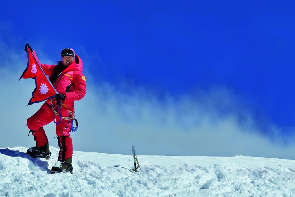 Pasang Lhamu Sherpa Akita on the summit of K2 on the China-Pakistan border, known as the world’s most dangerous mountain.
