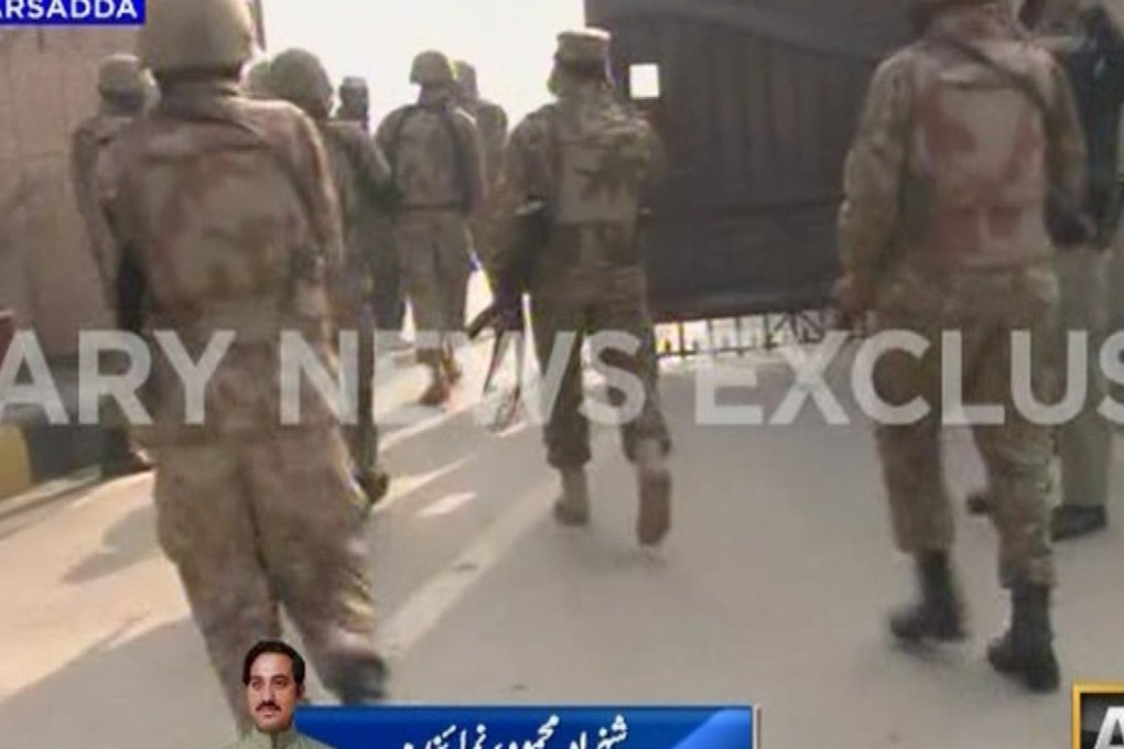 A screen shot from television news coverage of the attack on Bacha Khan University in Charsadda, northwestern Pakistan, shows soldiers entering the school. Photo: Reuters
