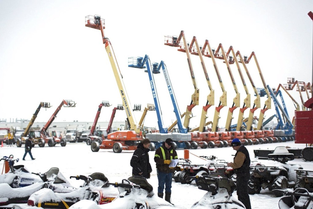 Buyers look over machinery at an auction in Nisku, Alberta, last month. Many sellers are oil companies reeling a rout in crude prices. Photo: Reuters