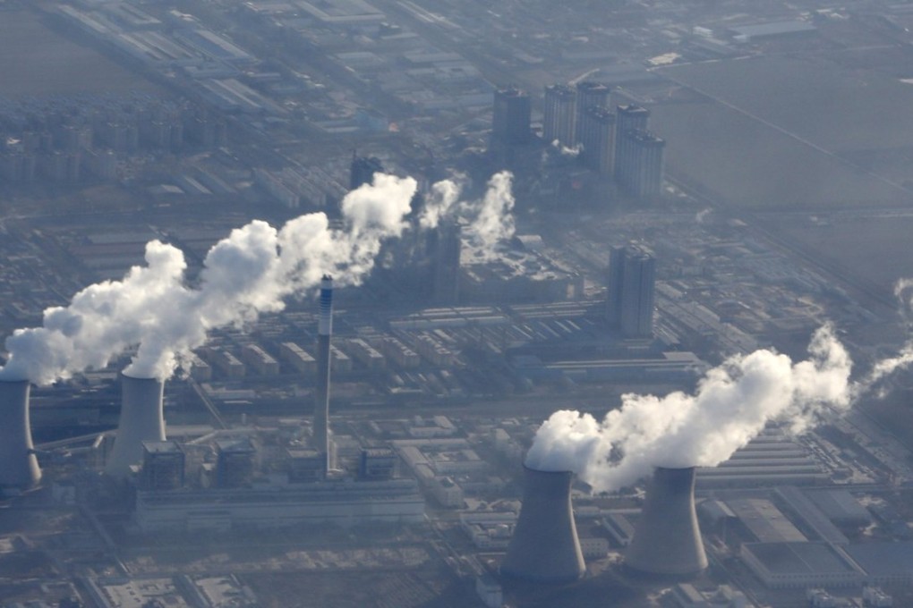 Chimneys churn out smoke at a power plant on the outskirts of Beijing. Photo: Reuters