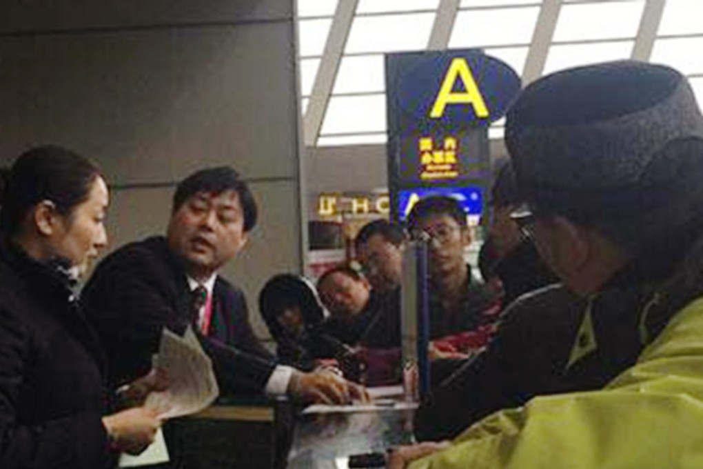 Angry passengers pictured with airline staff at the airport. Photo: SCMP Pictures