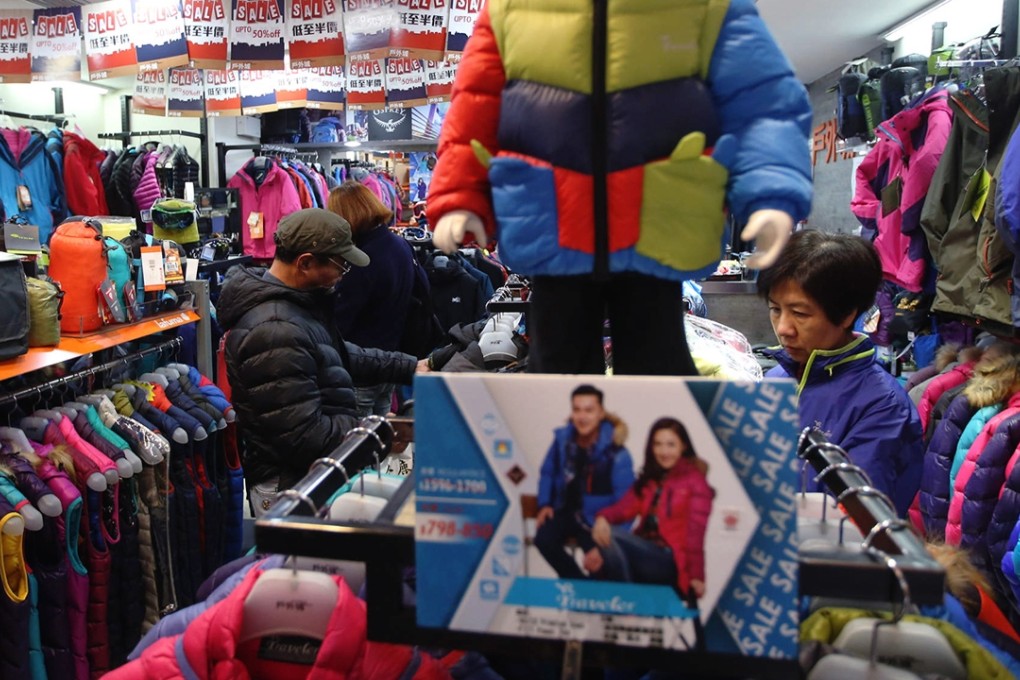 The cold spell has been a godsend for clothing retailers as more people button up. Photo: Sam Tsang