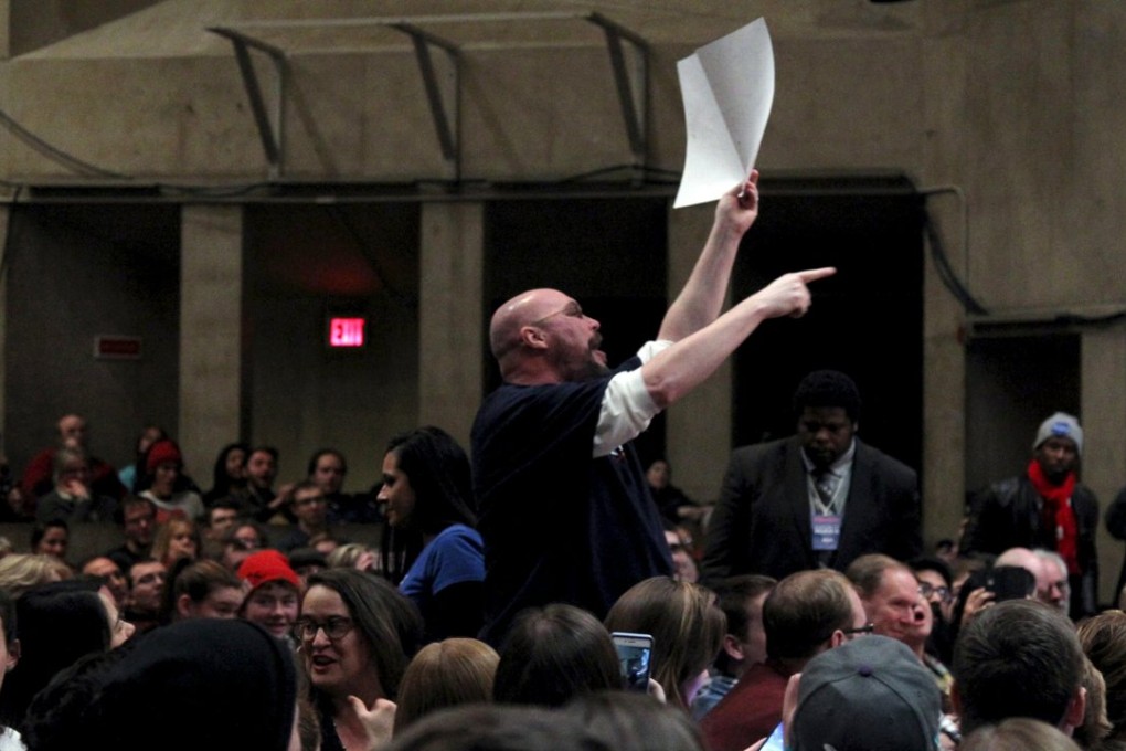 A supporter of Donald Trump disrupts US Democratic presidential candidate and Senator Bernie Sanders during a campaign rally in Amherst, Massachusetts on January 2. Photo: Reuters