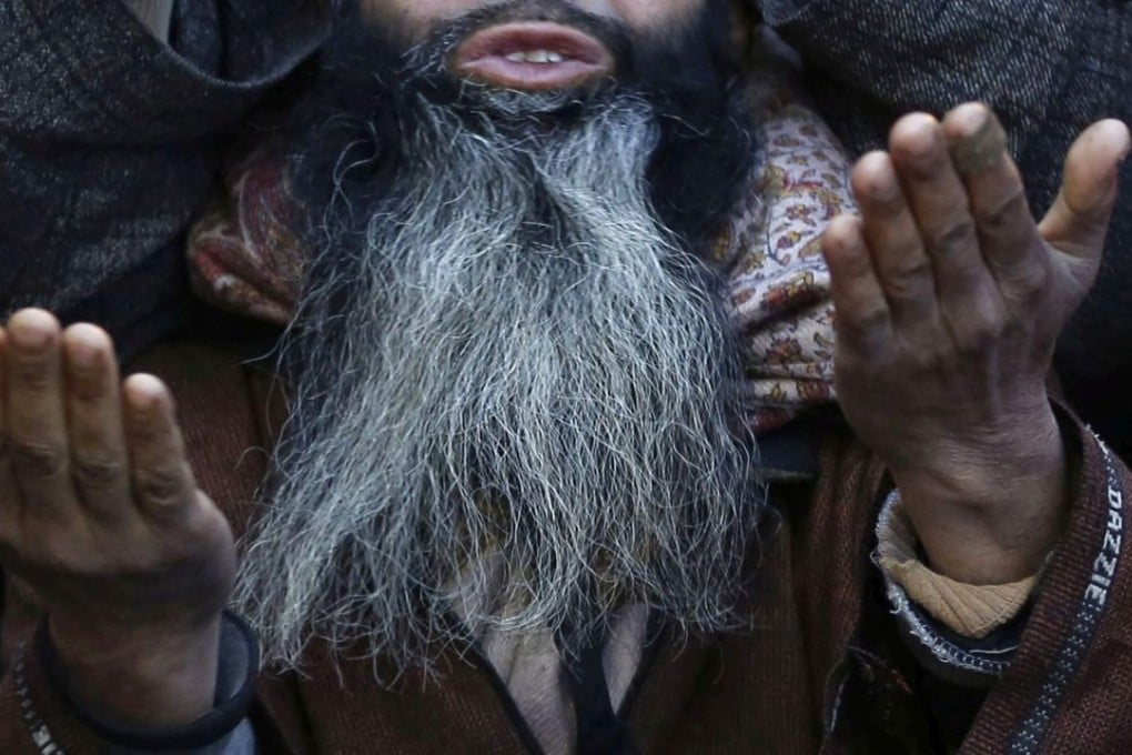 The police chief of southwest Tajikistan said that 12,818 men with “overly long and unkempt beards” had been “brought to order” in 2015. Photo: EPA