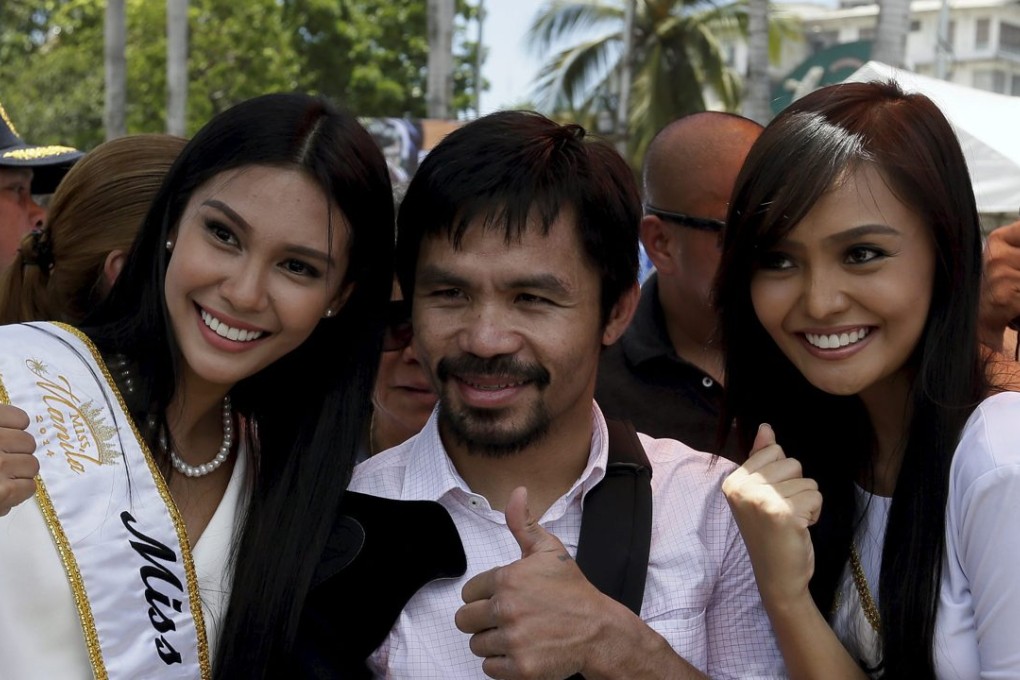 Filipino boxing icon Manny Pacquiao says he is hanging up his gloves to ‘focus on my other big responsibility in my daily life, to help the people’ after his final fight against Timothy Bradley. Photo: EPA