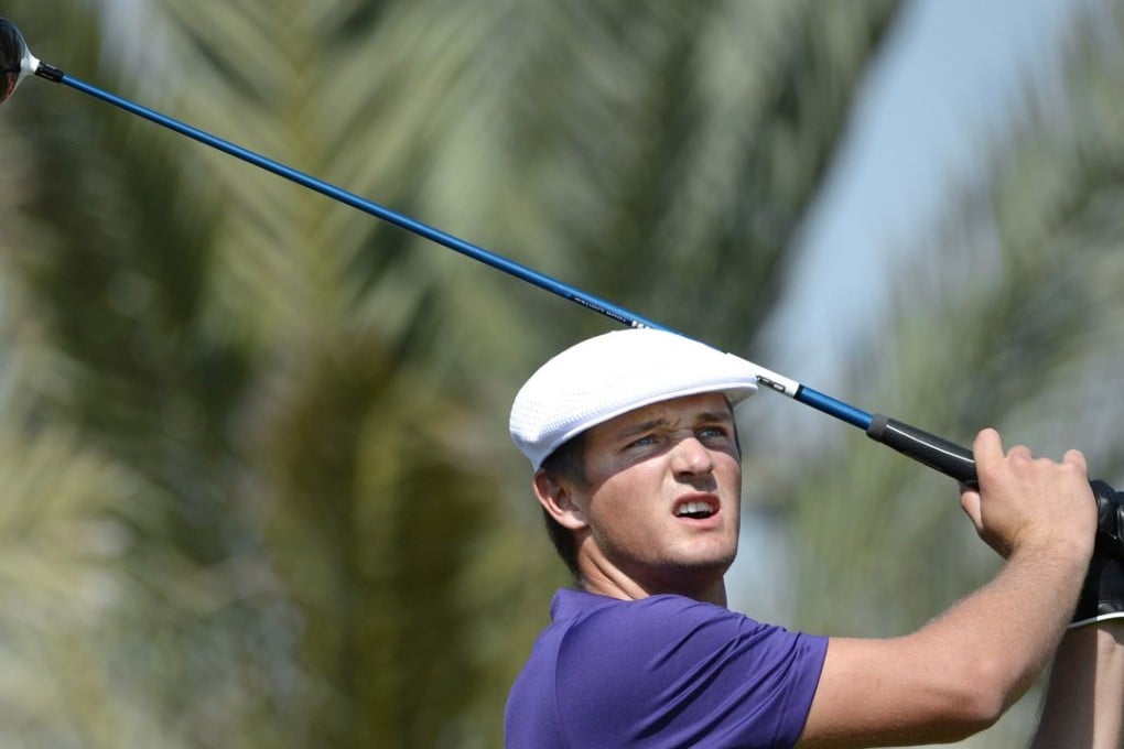 Bryson DeChambeau of the Unites States tees off at the 14th hole during the round one in Abu Dhabi on Thursday. Photo: AP