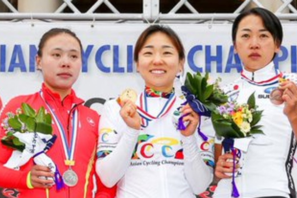 Women’s road race champion Na Ah-reum (centre), silver medalilst Pu Yixian (left) and bronze medallist Mayuko Hagiwara, of Japan, at their medal presentation. Na wins a ticket to Rio after winning the gold. Photo: SCMP Pictures
