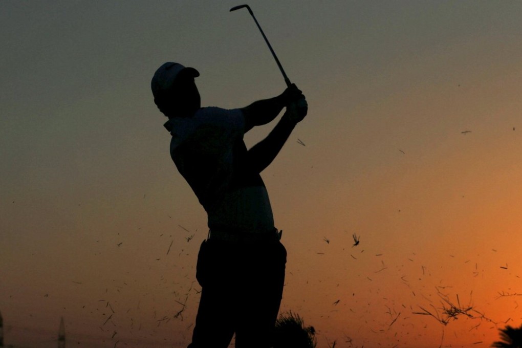 Rory McIlroy of Northern Ireland hits the ball on the ninth hole during the third round at Abu Dhabi. Photo: Reuters