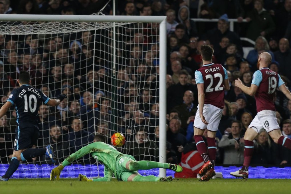 Manchester City's Sergio Aguero (left) scores his and Manchester City's second goal to equalise against West Ham. Photo: AFP