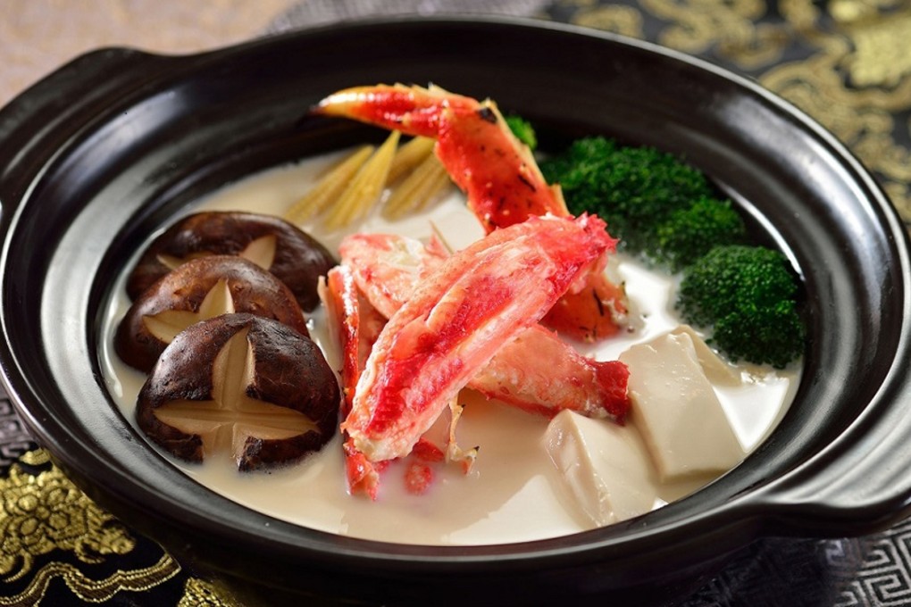 Alaskan king crab with soy milk and assorted vegetables in clay pot, available at Regal hotels.