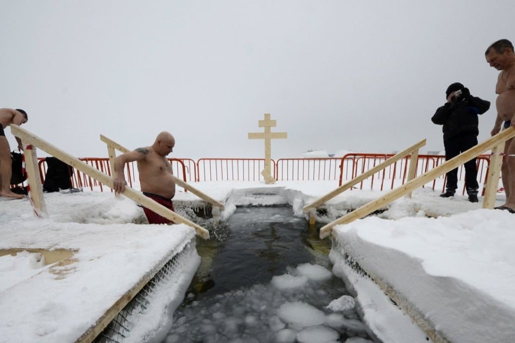 A man takes a dip in icy waters during celebrations for the Orthodox Epiphany on the Sea of Japan (East Sea) in the far eastern city of Vladivostok, Russia, on January 19. Photo: Reuters