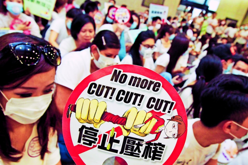 Flight attendants for the airline gathering in Wan Chai over a pay and benefits dispute last May. Photo: SCMP Pictures