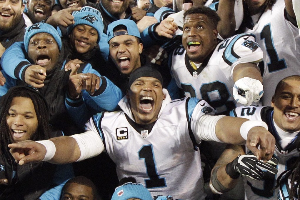 The Carolina Panthers' Cam Newton celebrates with teammates. Photo: AP