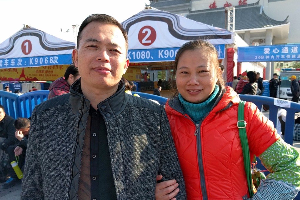 Liu Mei (right) and her husband, Chu Yangjian, wait to board their train home at the Foshan train station on Monday. Photo: Gloria Chan