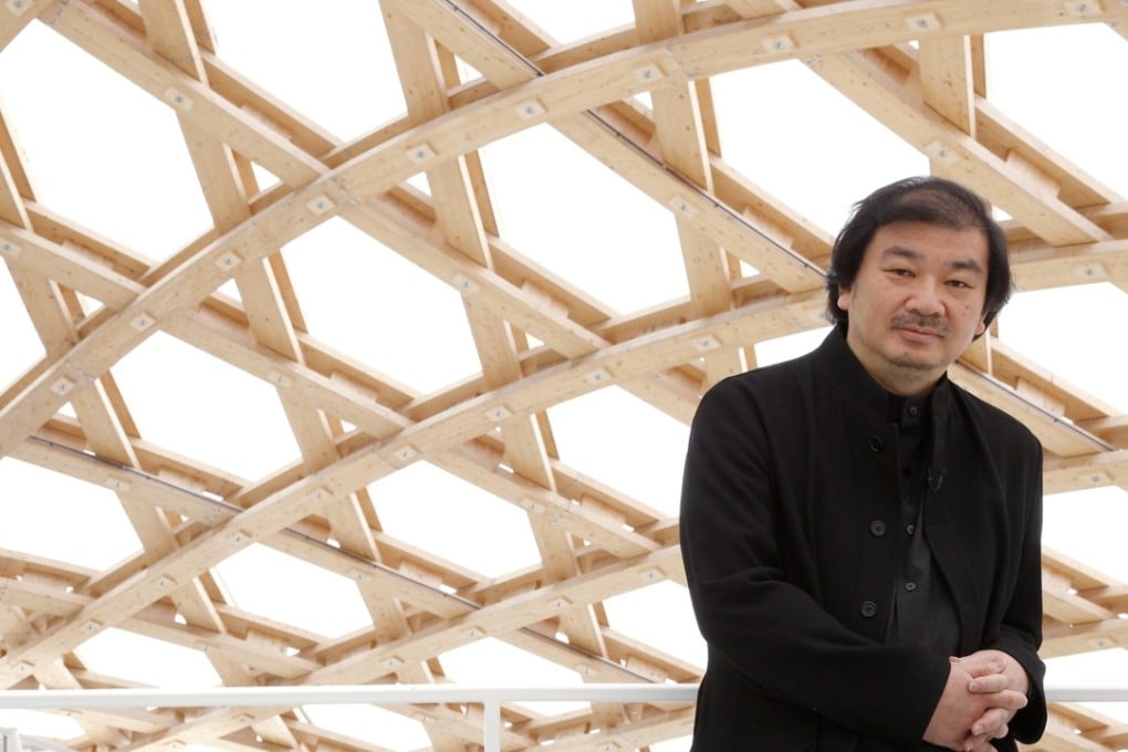 Shigeru Ban stands under his design for the Centre Pompidou-Metz museum in France. Photo: Reuters