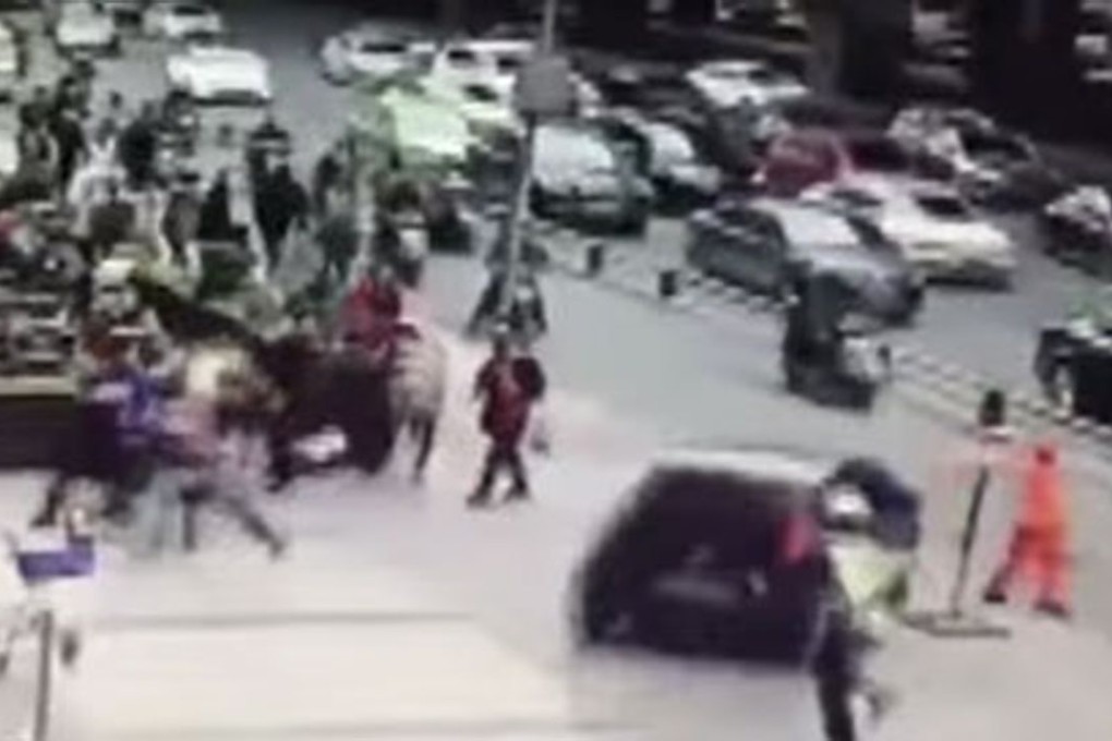 The driver speeds towards the pedestrians. Photo: CCTV News/YouTube