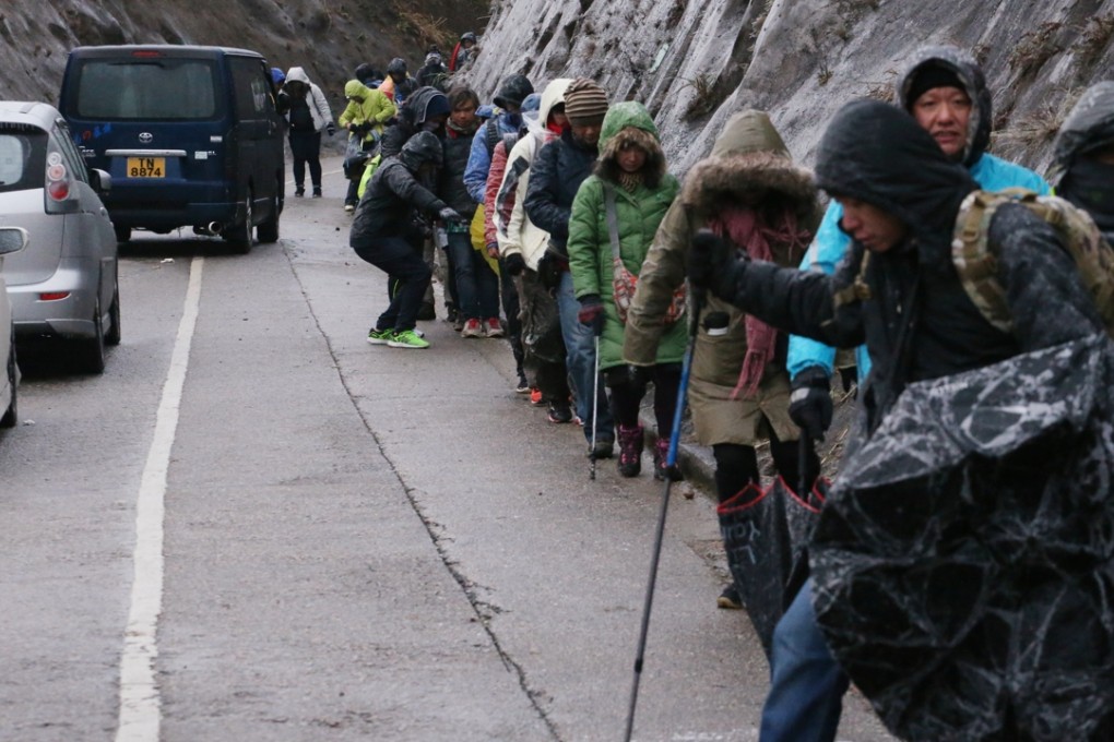 Visitors to Tai Mo Shan on Sunday had to call for help. Photo: Felix Wong