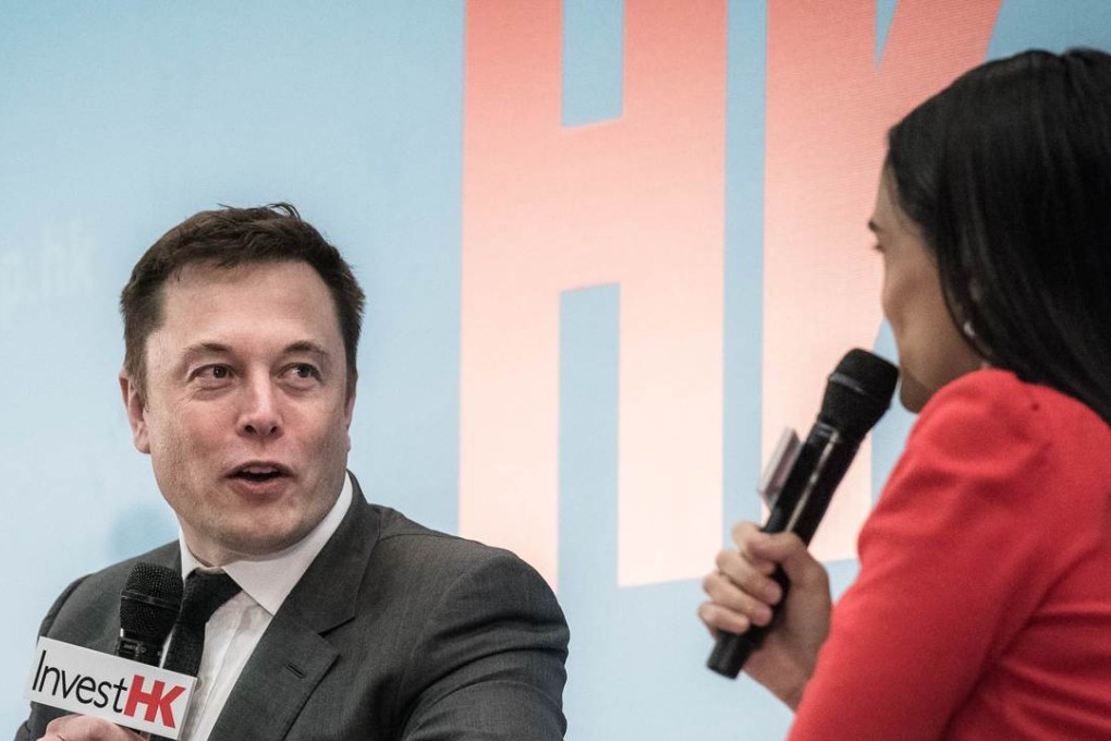 Elon Musk, the co-founder of luxury all-electric US car maker Tesla, is interviewed by CNN’s Kristie Lu Stout at the StartmeupHK Venture Forum in Hong Kong today. Plunging oil prices will force electric car makers to design futuristic vehicles to entice buyers if the industry is to ride out current challenges, Musk said. Photo: AFP
