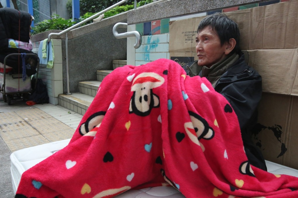 A homeless man trying to keep warm in Yau Ma Tei during the recent cold weather warning. Photo: Edward Wong
