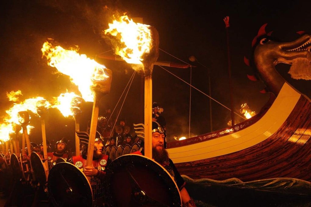 Participants dressed as Vikings parade around their longboat during the annual Up-Helly-Aa festival in Lerwick, Shetland Islands on Tuesday. Photo: AFP