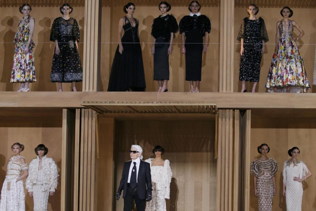 German designer Karl Lagerfeld appears at the end his haute couture spring/summer 2016 collection for fashion house Chanel at the Grand Palais in Paris, presented in a Japanese-style wooden building and garden. Photo: Reuters