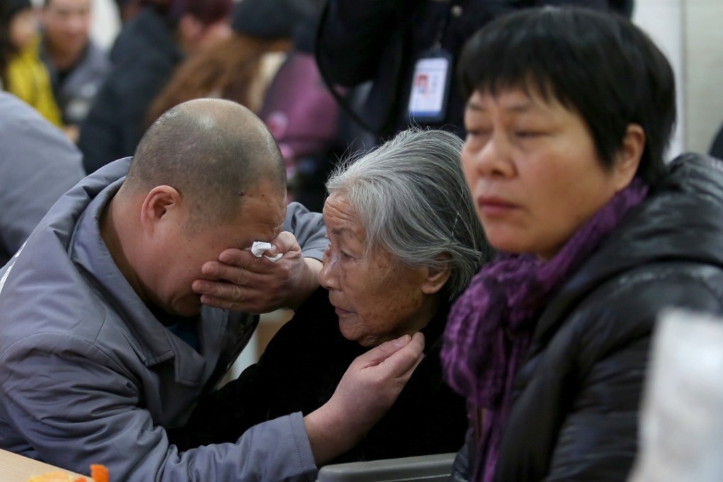 A man weeps as he meets his elderly mother, who has cancer, in a home in Taizhou, Zhejiang province. China’s ageing population is one reason overall cancer deaths have risen despite a reduction in mortality rates. Photo: China Foto Press