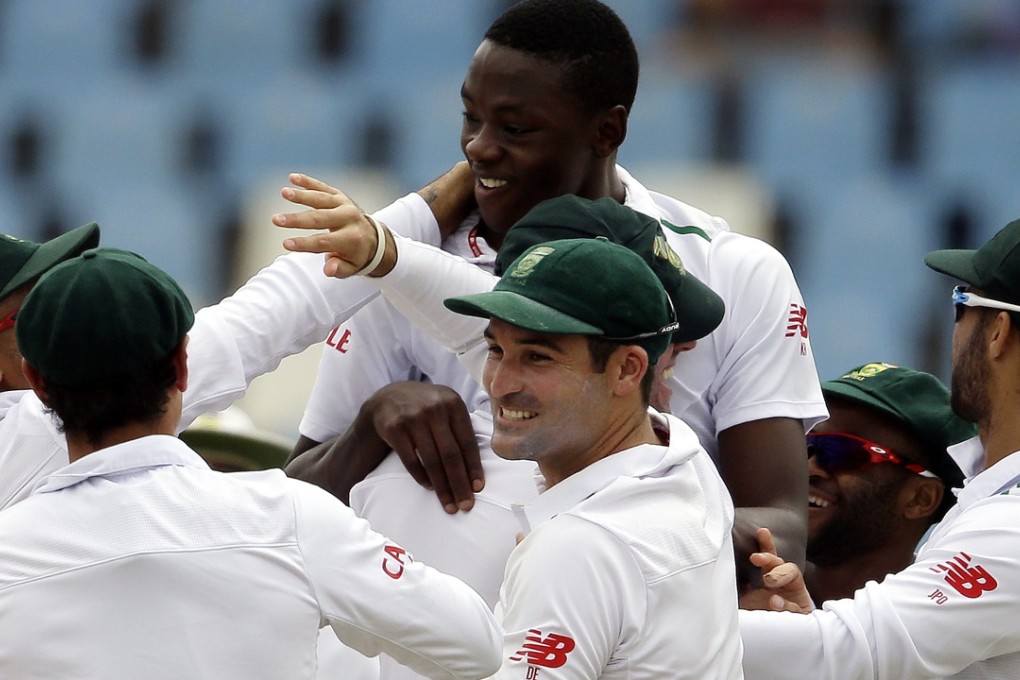South Africa bowler Kagiso Rabada celebrates with teammates after dismissing England batsman Jonathan Bairstow on the fifth day of the fourth test at Centurion. The Proteas beat the tourists by 280 runs. Photo: AP
