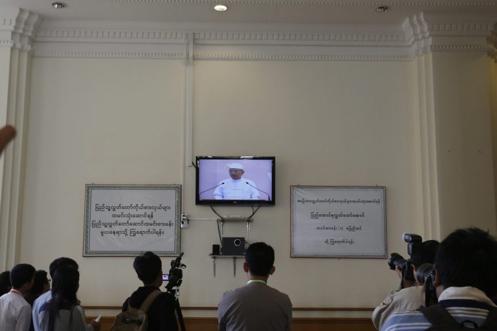 Members of the press watch Myanmar President Thein Sein speak in Naypyidaw. Photo: EPA