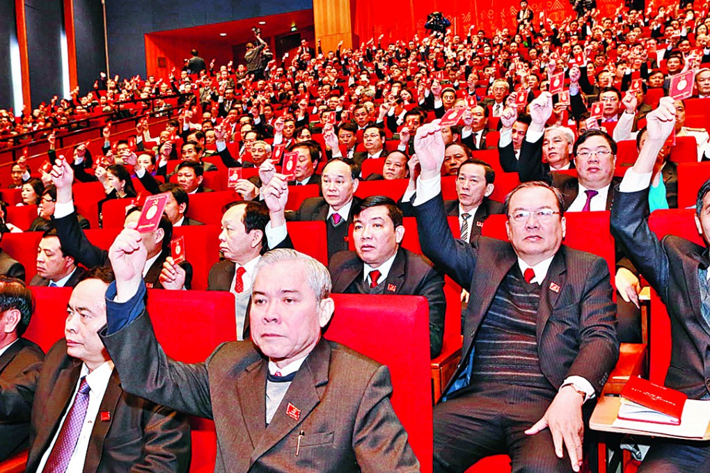 Delegates vote to adopt a resolution at the Communist Party of Vietnam’s five-yearly congress. Photo: Xinhua