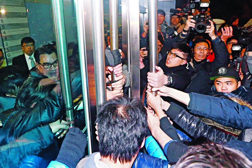 Students try to break into the Hong Kong Jockey Club Building for Interdisciplinary Research on Sassoon Road in Pok Fu Lam. Photo: Sam Tsang