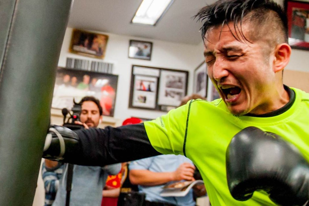 China’s Zou Shiming works out in preparation for his first bout in 10 months in “The Return of the King” in Shanghai. Photo: AFP