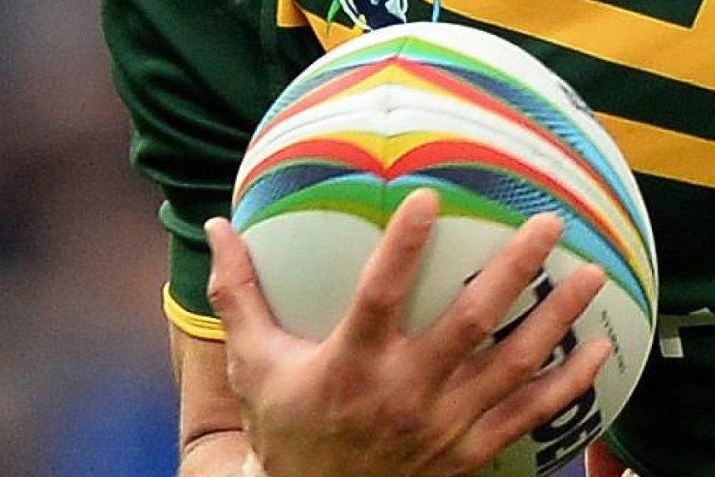 (FILES) A file photo taken on November 30, 2013, shows Australia's Jarryd Hayne (L) tackled during the 2013 Rugby League World Cup Final between Australia and New Zealand at Old Trafford in Manchester. Australian rugby league convert Jarryd Hayne said August 3, 2015 he is unfazed by the prospect of facing his first full-blooded collision with the San Francisco 49ers as he chases his dream of forging a career in the NFL. The 27-year-old former Australia, New South Wales and Parramatta Eels star signed with the 49ers in March during offseason workouts and is now battling to make the cut ahead of the start of the regular season in September. Hayne's speed and footwork have seen him earkmarked as being either a running back or a kick-returner on special teams. However he has revealed that he has been working on altering his distinctive upright running style that made him such a success in rugby league, aiming to get lower to make him harder to hit. AFP PHOTO/FILES/PAUL ELLIS