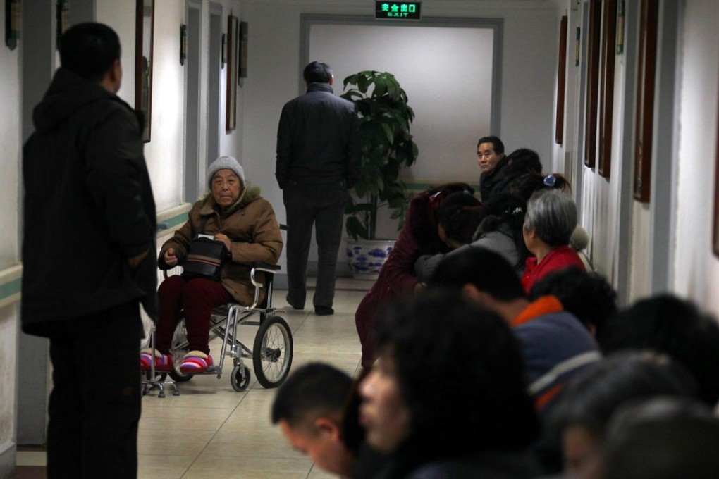 A file photo of patients and family members waiting for treatment along a corridor at the Guanganmen Hospital in Beijing. Photo: Reuters