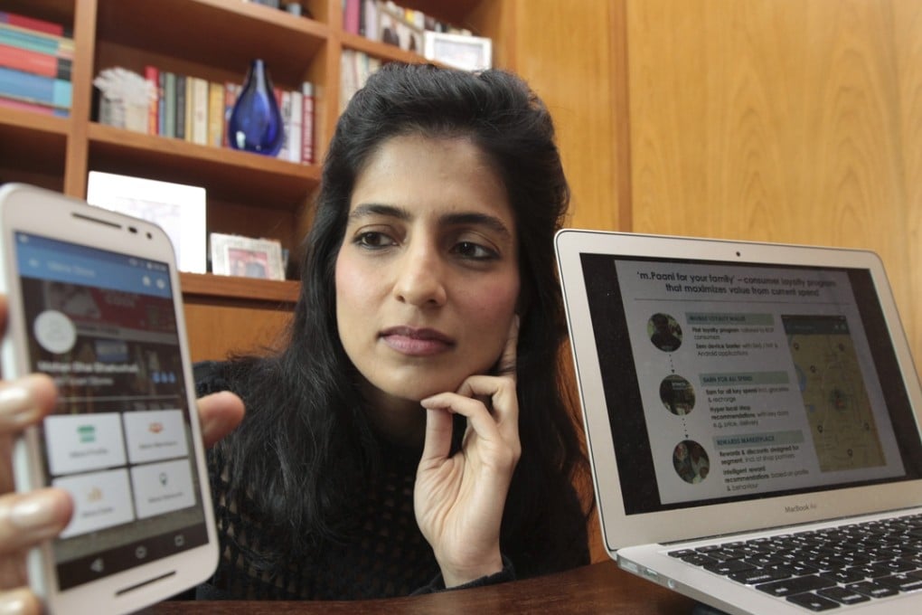 Akanksha Hazari, CEO and founder of m. Paani, shows the app for the charity. Photo: Bruce Yan