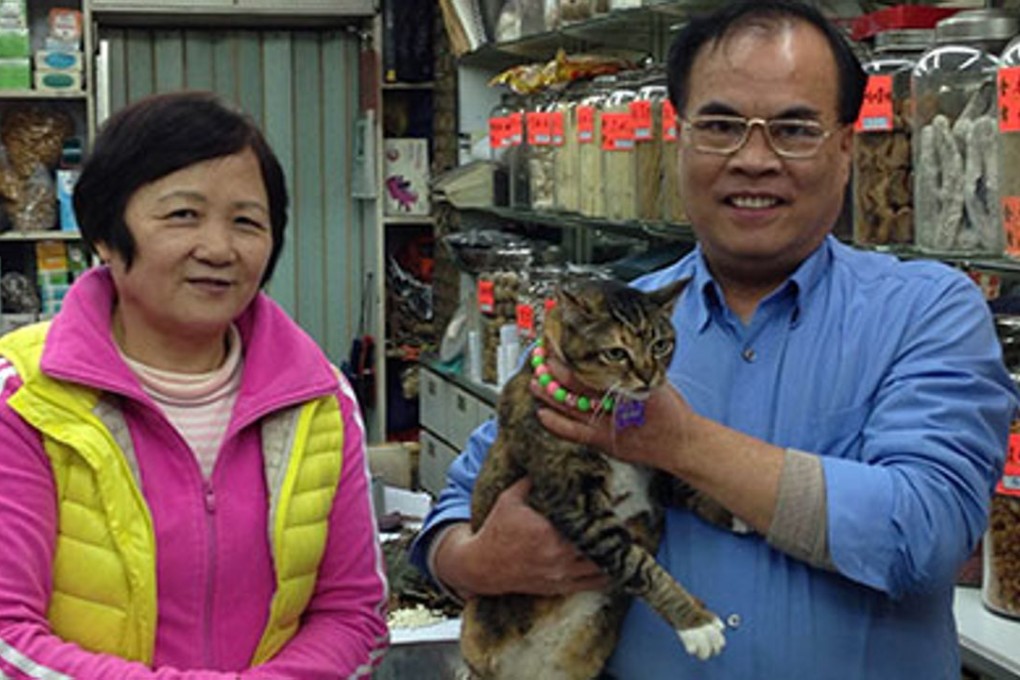 Lau Siu-kwong (right) and his wife Lau Fung Ying with Hawaii at their store. Photo: Rachel Blundy