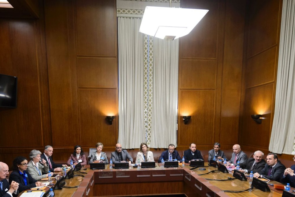 Syrian ambassador to UN and head of the government delegation Bashar al-Jaafari (far right) faces Syria UN envoy Staffan de Mistura (far left) at the opening of Syrian peace talks at the United Nations offices in Geneva on January 29, 2016. The talks are aimed at ending Syria's conflict but the absence of key opposition members threatens to derail the process. Photo: AFP