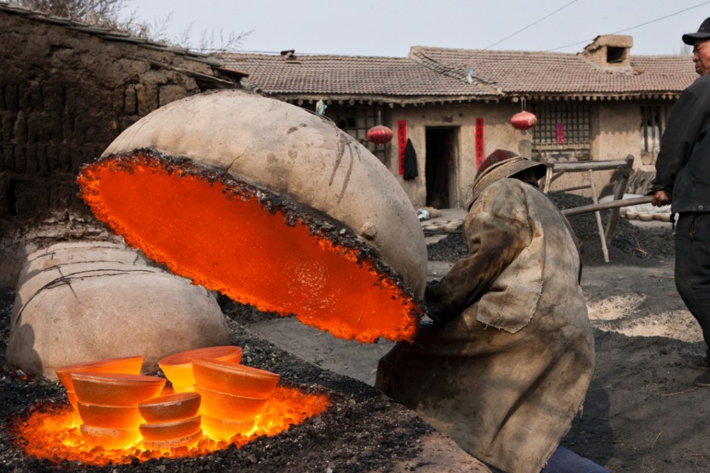 Foundry workers tend a furnace in Hebei province. China has ample but low-quality iron resource that is costly to process into usable output. Photo: Xinhua