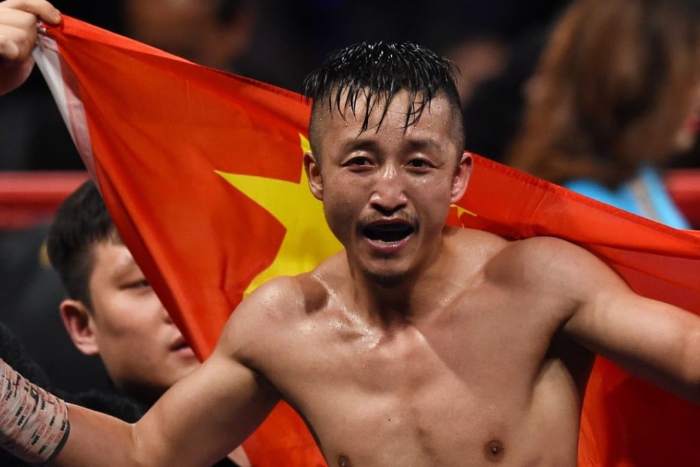 Zou Shiming of China celebrates after defeating against Natan Santana Coutinho of Brazil. Photos: AFP