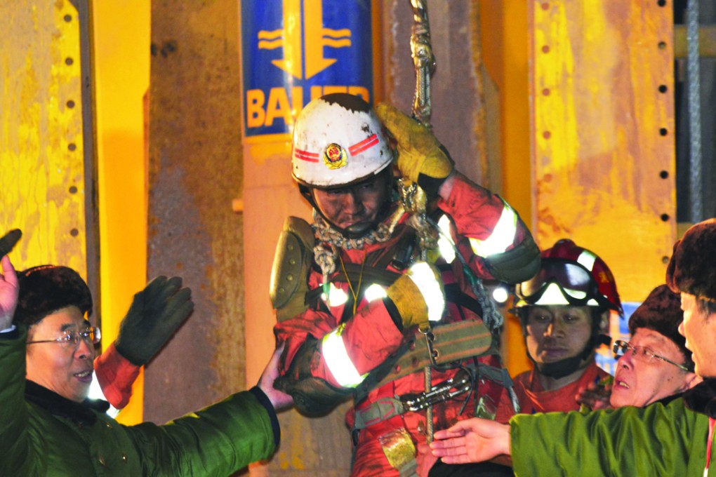 A trapped worker is lifted from a collapsed mine in Pingyi in Shandong province. Photo: Reuters