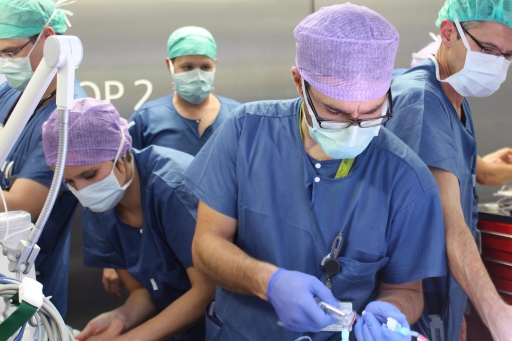 Doctors and nurses during the surgery to separate conjoined twins Lydia and Maya in Bern. Photo: EPA