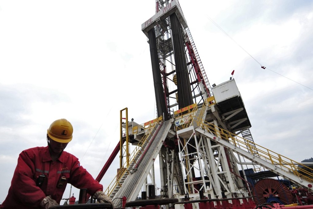 A worker performs a routine check on the valves at a natural gas appraisal well of Sinopec in Langzhong county, Sichuan province in China. Photo: Reuters
